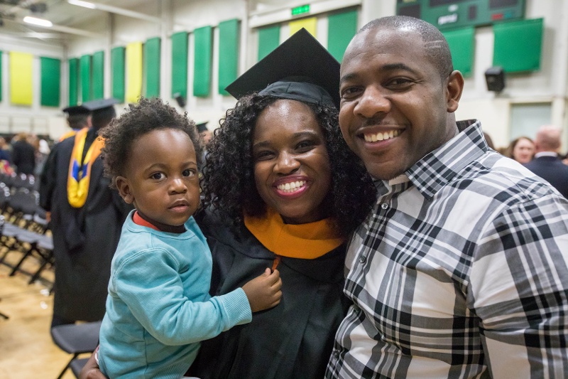 female college student and family at graduation