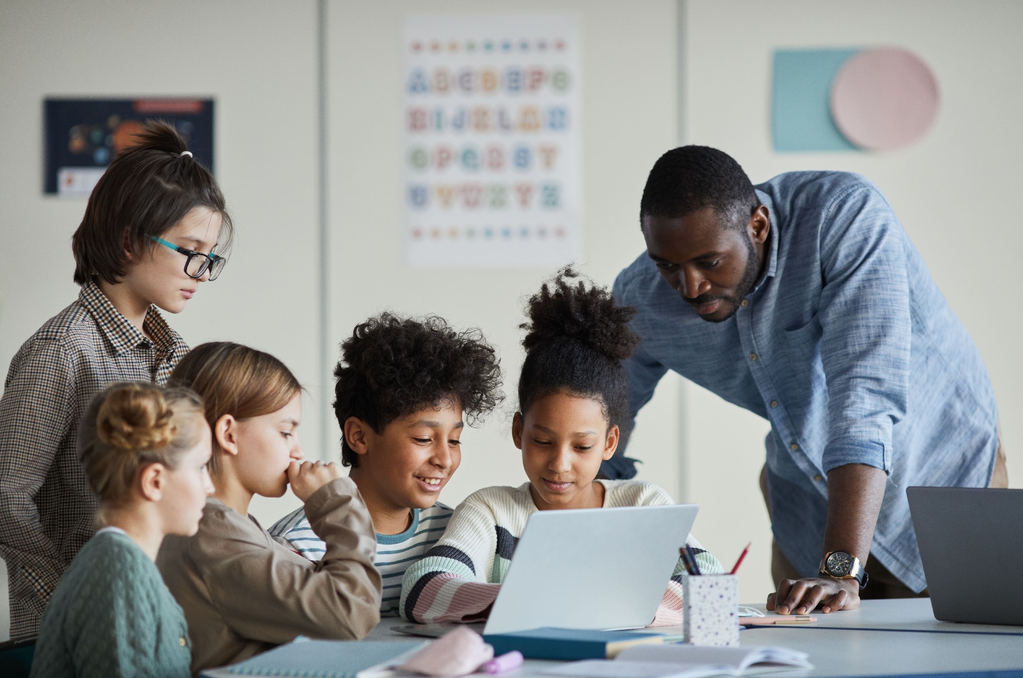 Male teacher working with students