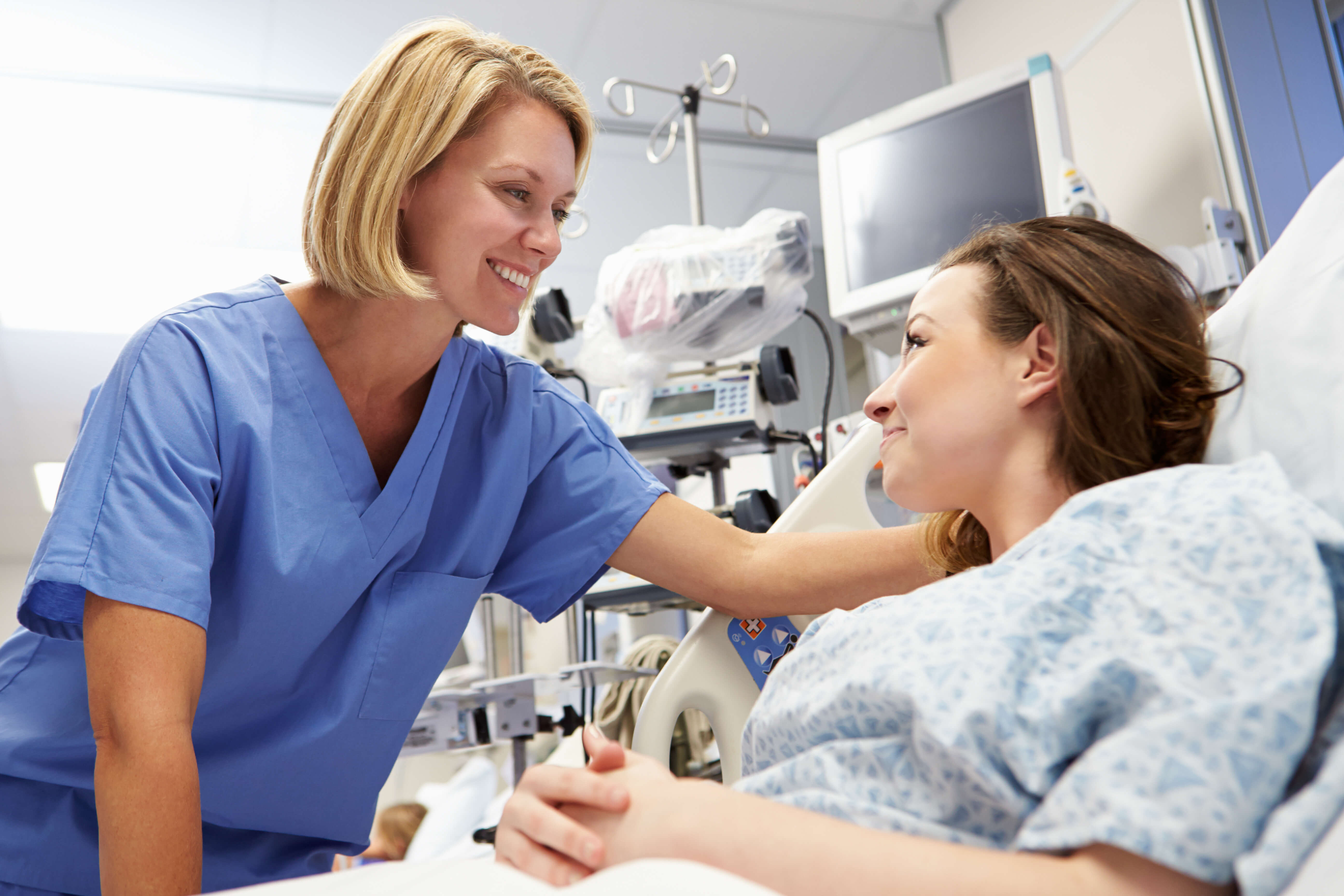 Nurse working with a female patient