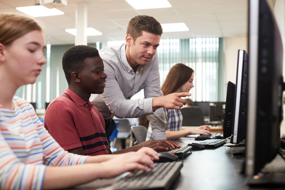 Teacher in the computer lab with students-1