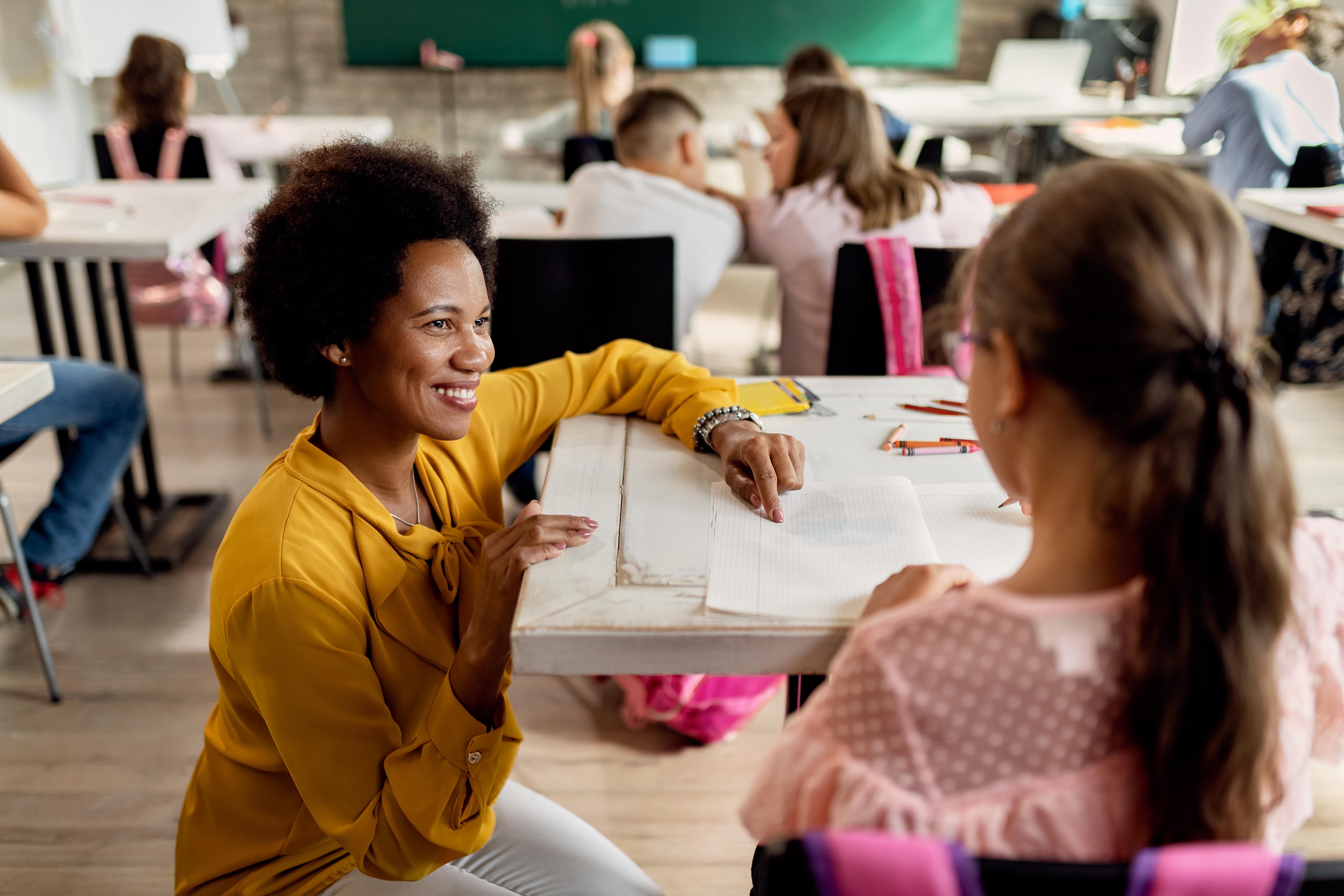 Young teacher working with a student